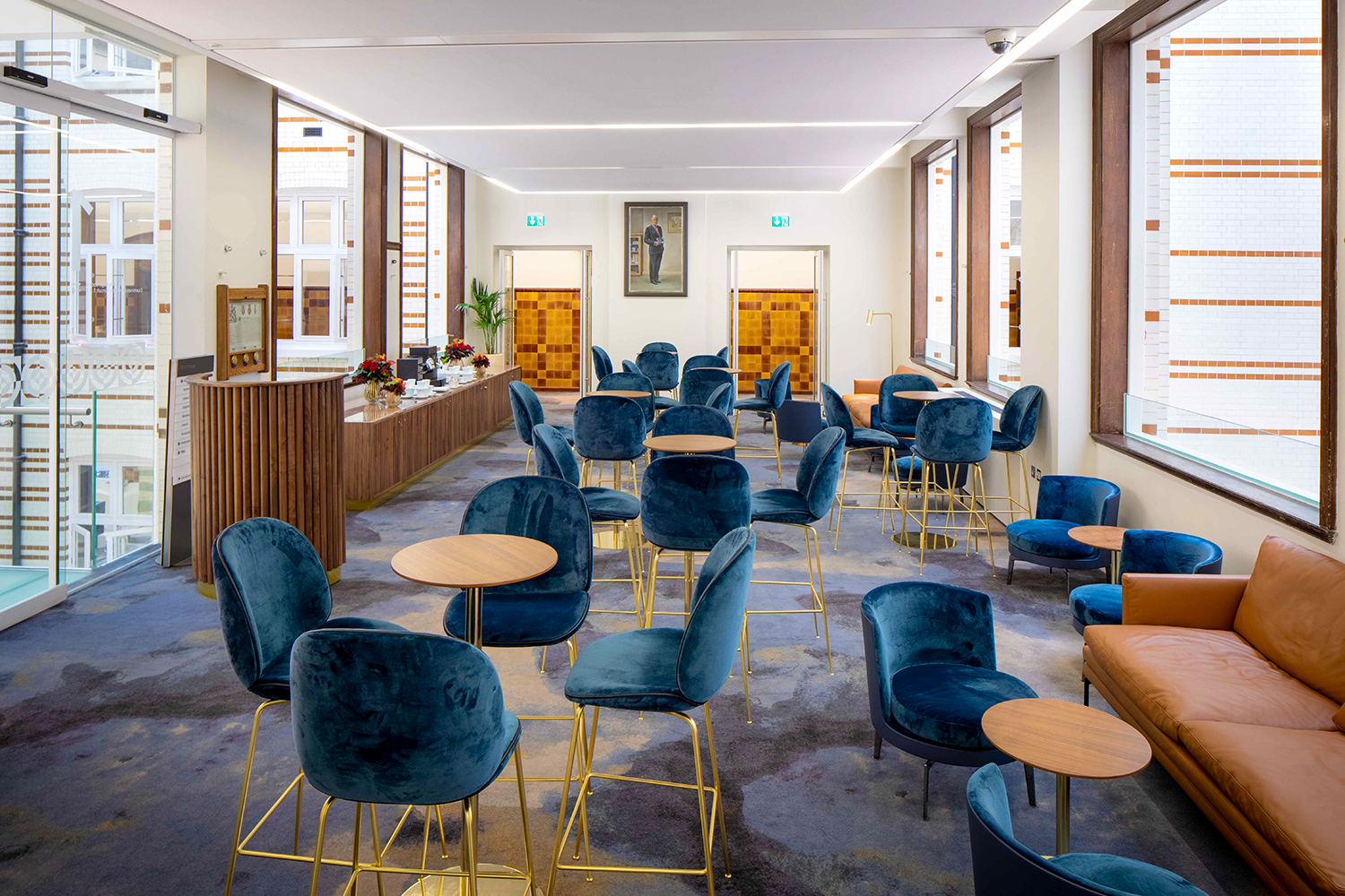 Modern meeting space with plush seating at The Heritage Rooms, perfect for networking events.