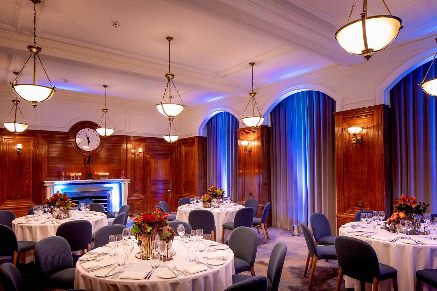 Elegant event space with floral centerpieces at The Heritage Rooms, ideal for meetings and gatherings.