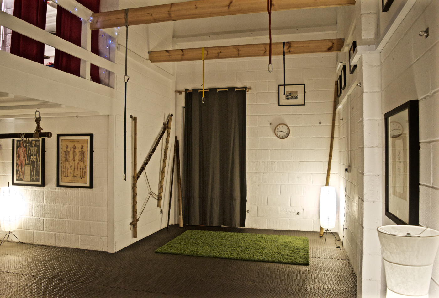 Versatile minimalist event space with exposed beams for meetings and workshops.