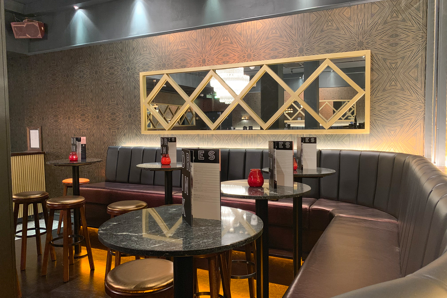 Chic lounge with booth seating at The Hide in Sway for networking and intimate gatherings.