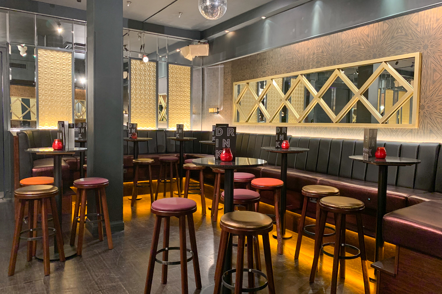 Sophisticated event space with high-top tables, perfect for networking and cocktail receptions.