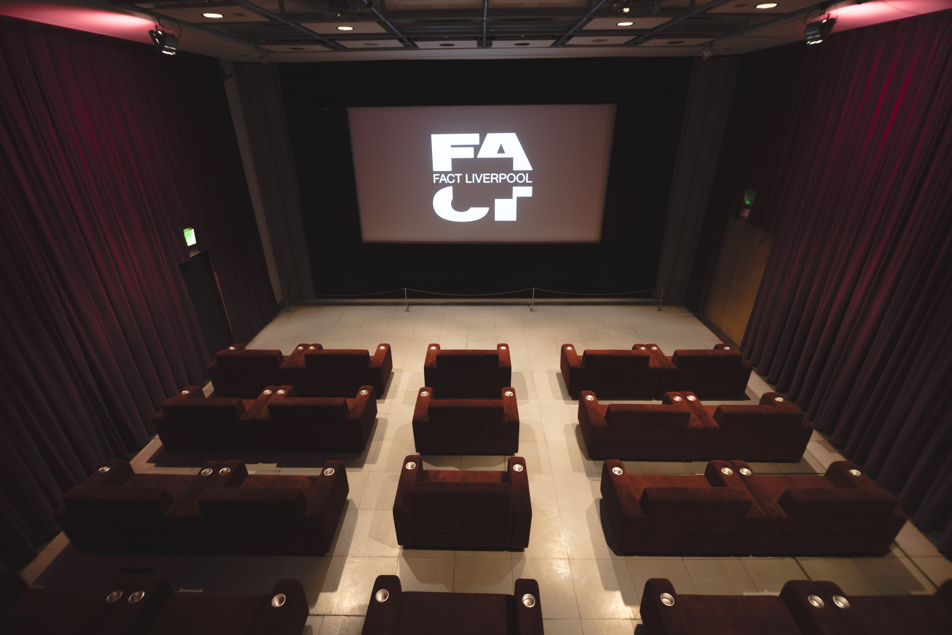 Modern event space The Box in FACT Liverpool with plush seating for intimate gatherings.