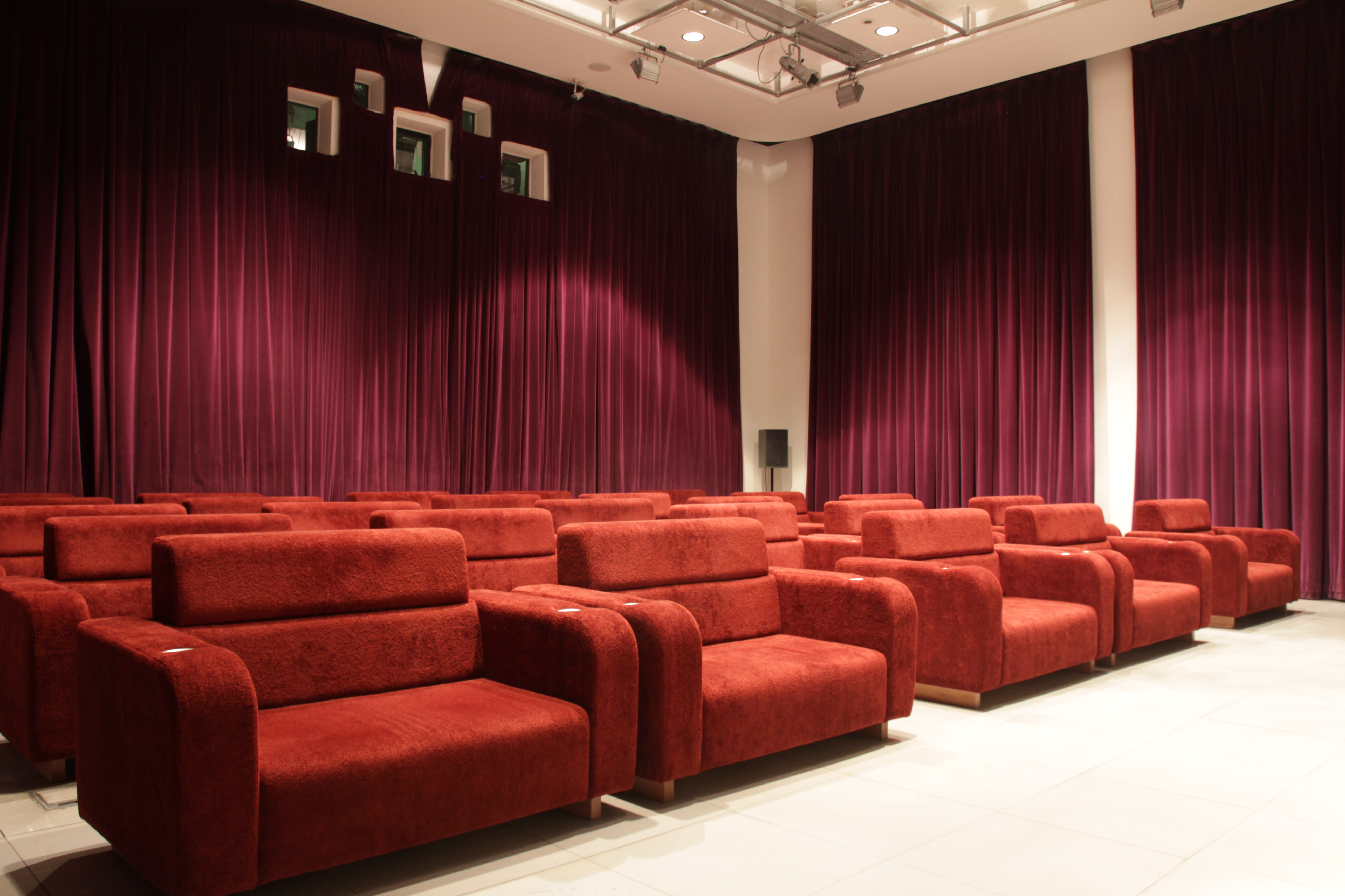 Modern meeting space with plush red seating, perfect for workshops and seminars in Liverpool.