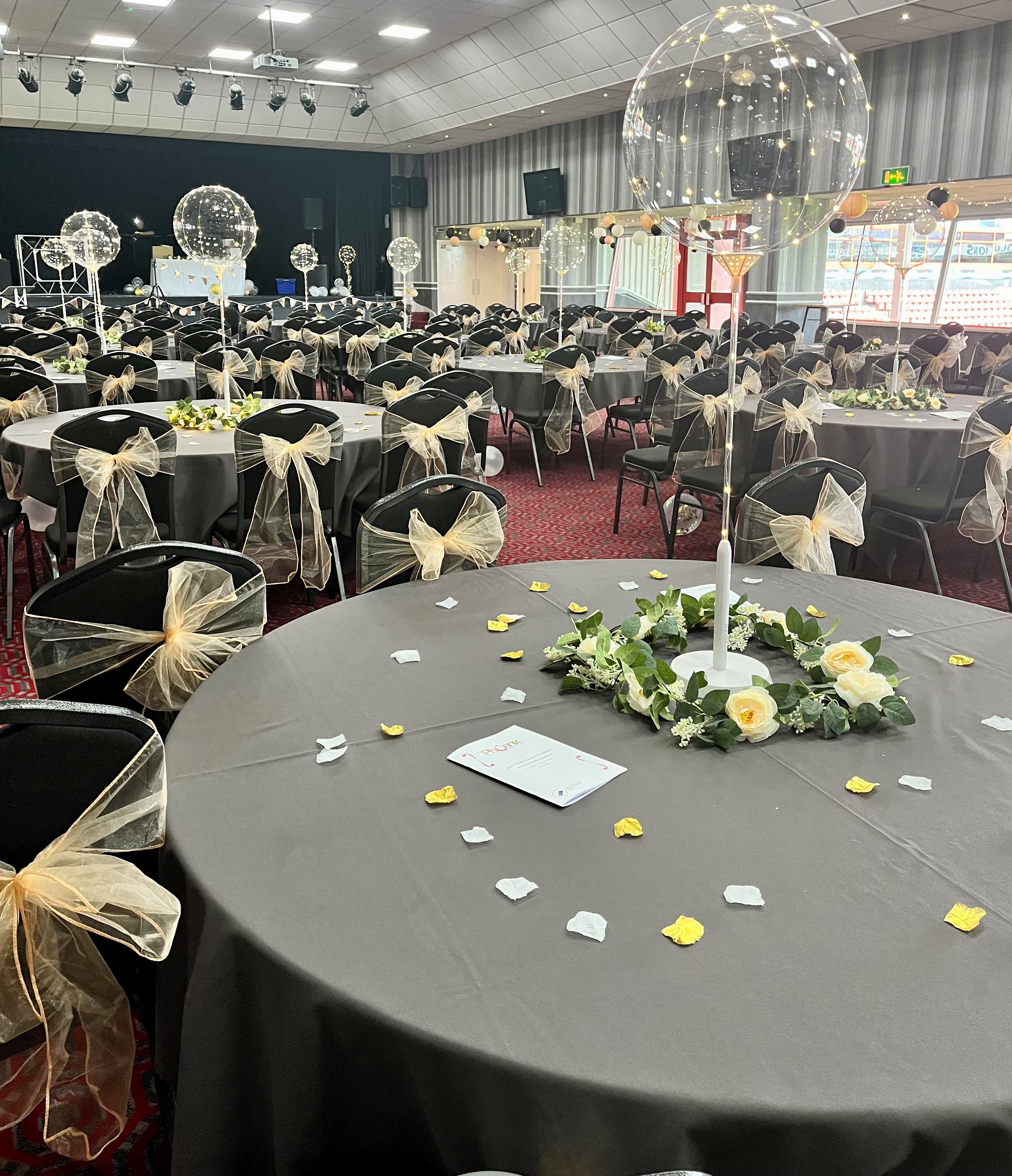 Elegant event space at Walsall FC with round tables, perfect for weddings and gatherings.