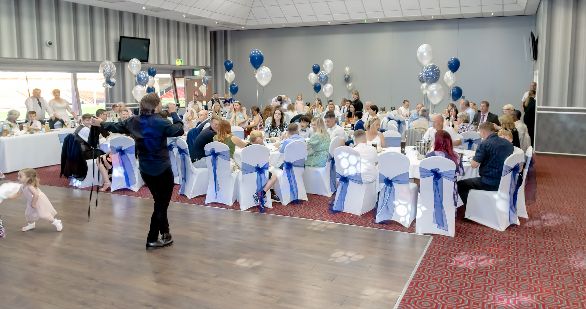 Albert McPherson Lounge at Walsall FC, elegantly decorated for a formal event.