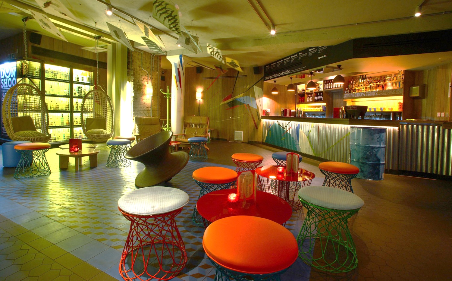 Vibrant Azulito Bar with eclectic seating for casual networking and cocktail receptions.