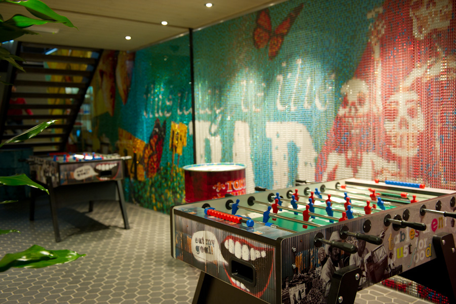 Vibrant Azulito Bar with foosball tables for networking and team-building events.