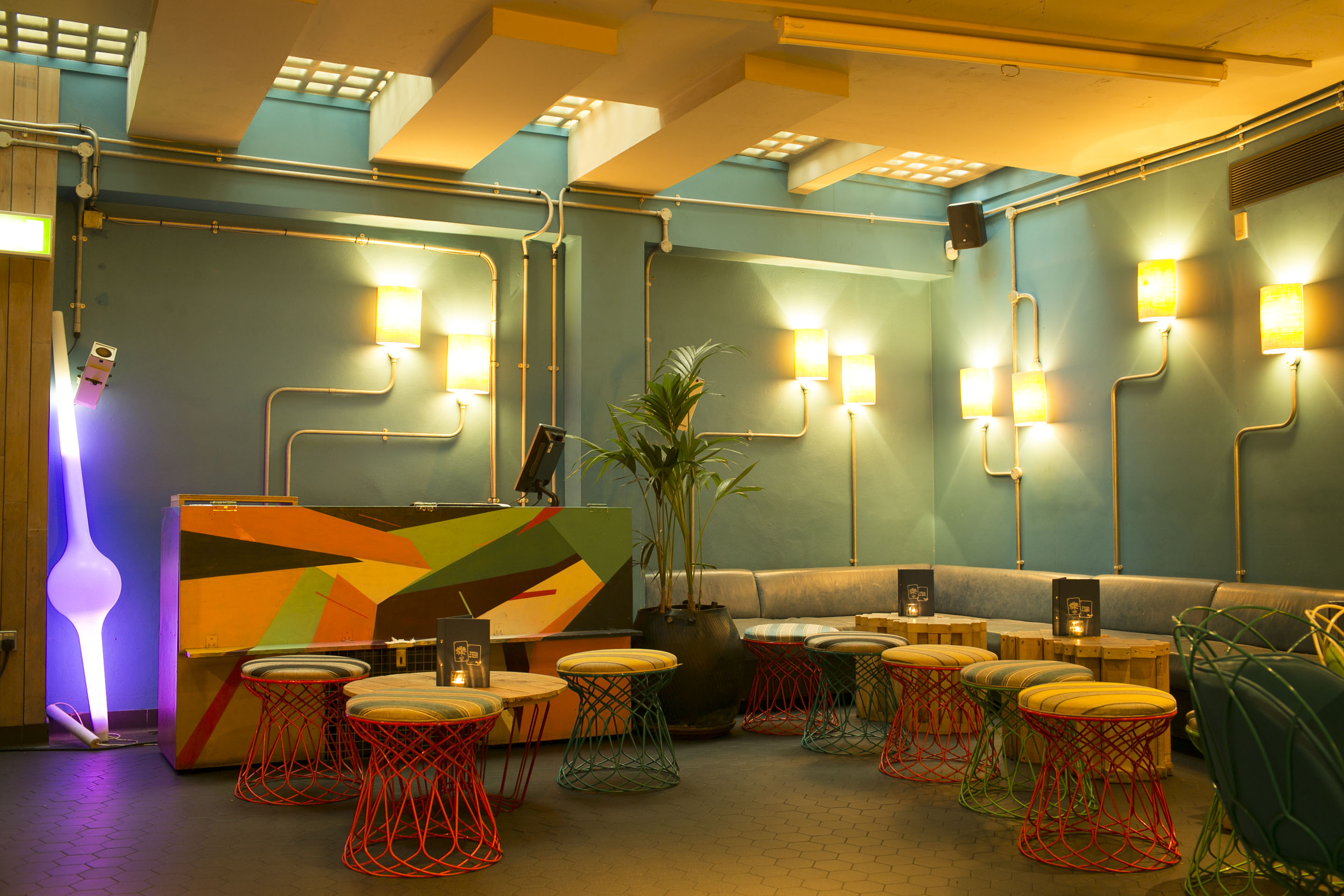 Vibrant Azulito Bar with colorful seating, ideal for networking events and receptions.