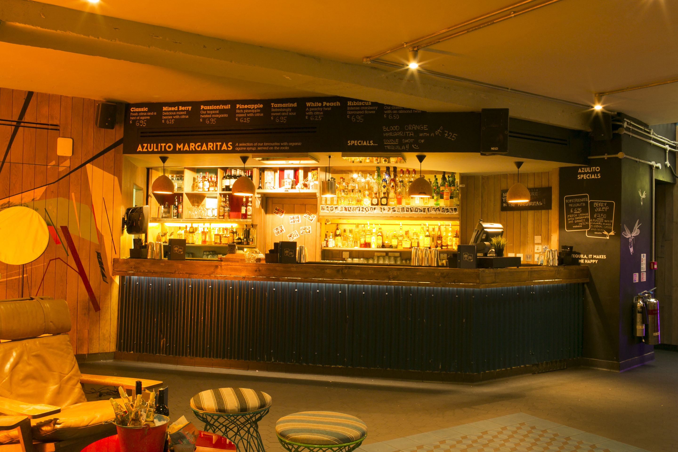 Vibrant Azulito Bar with warm lighting, perfect for networking events and gatherings.