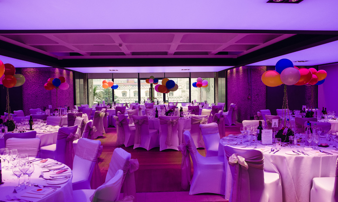 Elegant event space at Barbican Centre with festive balloons for galas and celebrations.