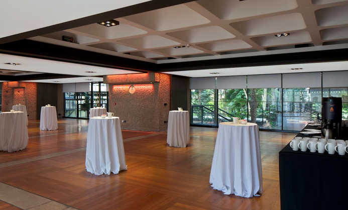 Elegant high-top tables in The Garden Room, Barbican Centre for networking events.