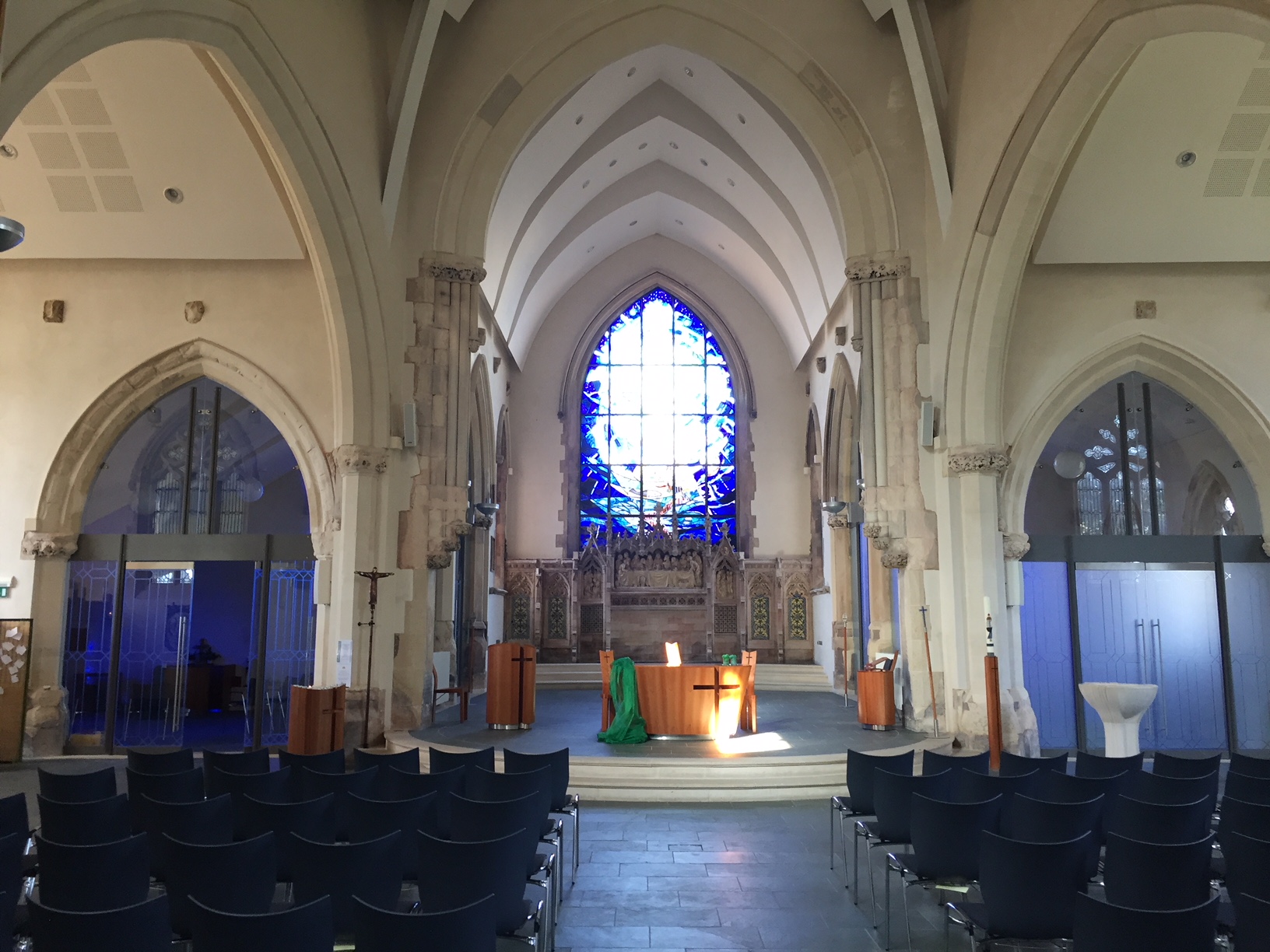 Lighthouse event space in St Barnabas Church with stained glass, ideal for weddings and conferences.