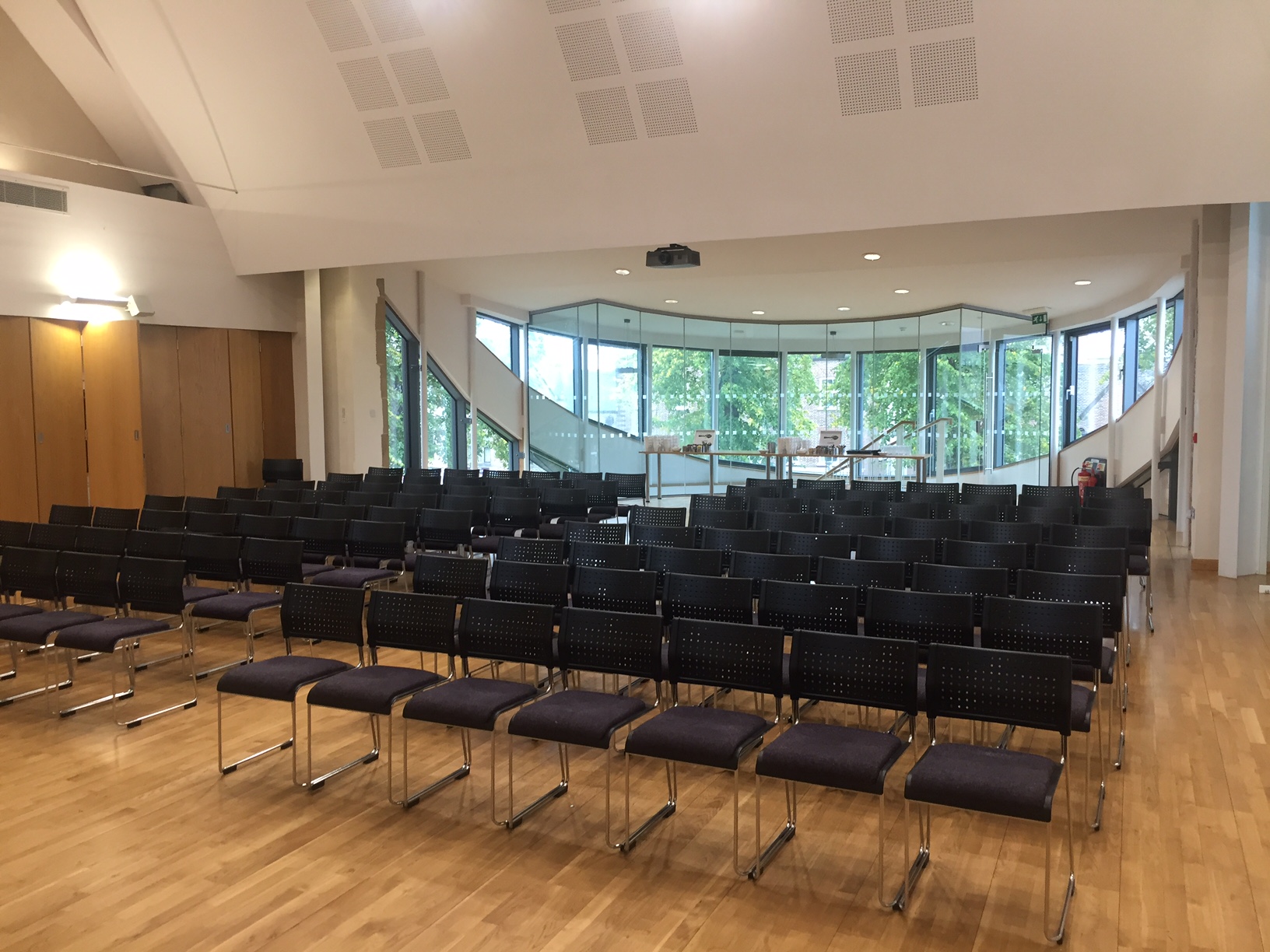Lighthouse event space in St Barnabas Church with black chairs for workshops and presentations.