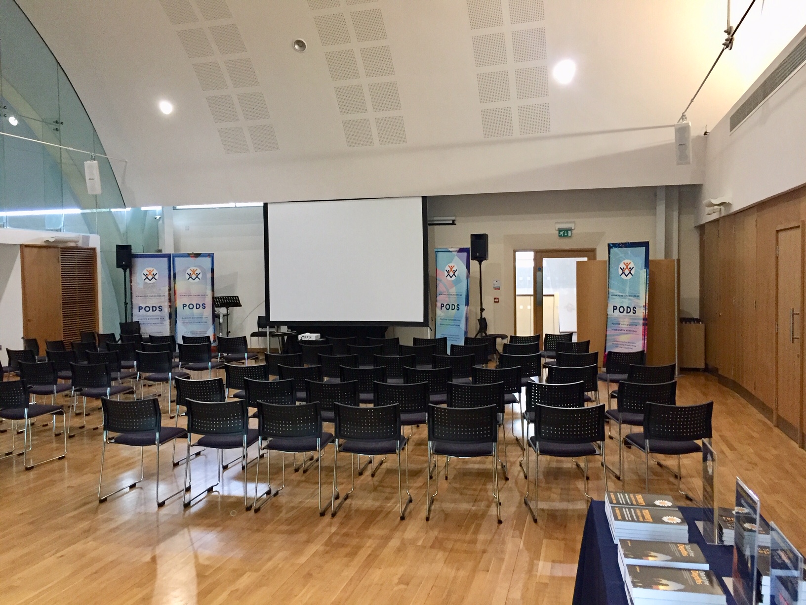 Event space at St Barnabas Church Centre with chairs and projection screen for conferences.