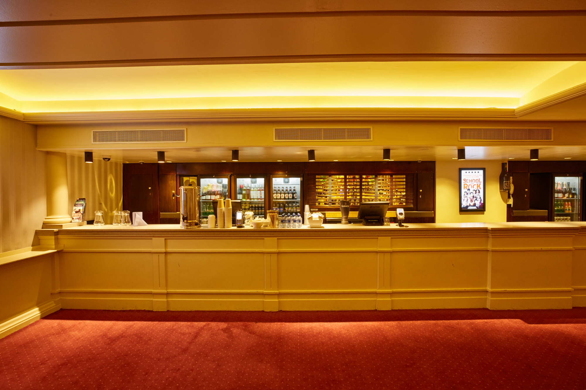 Val Parnell Bar at London Palladium: sleek refreshment area with organized snacks and drinks.