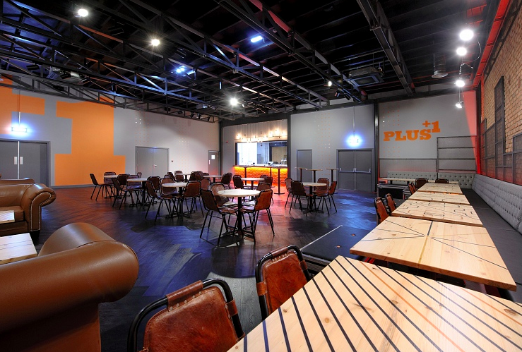 Versatile event space at Manchester Arena with flexible seating for networking events.