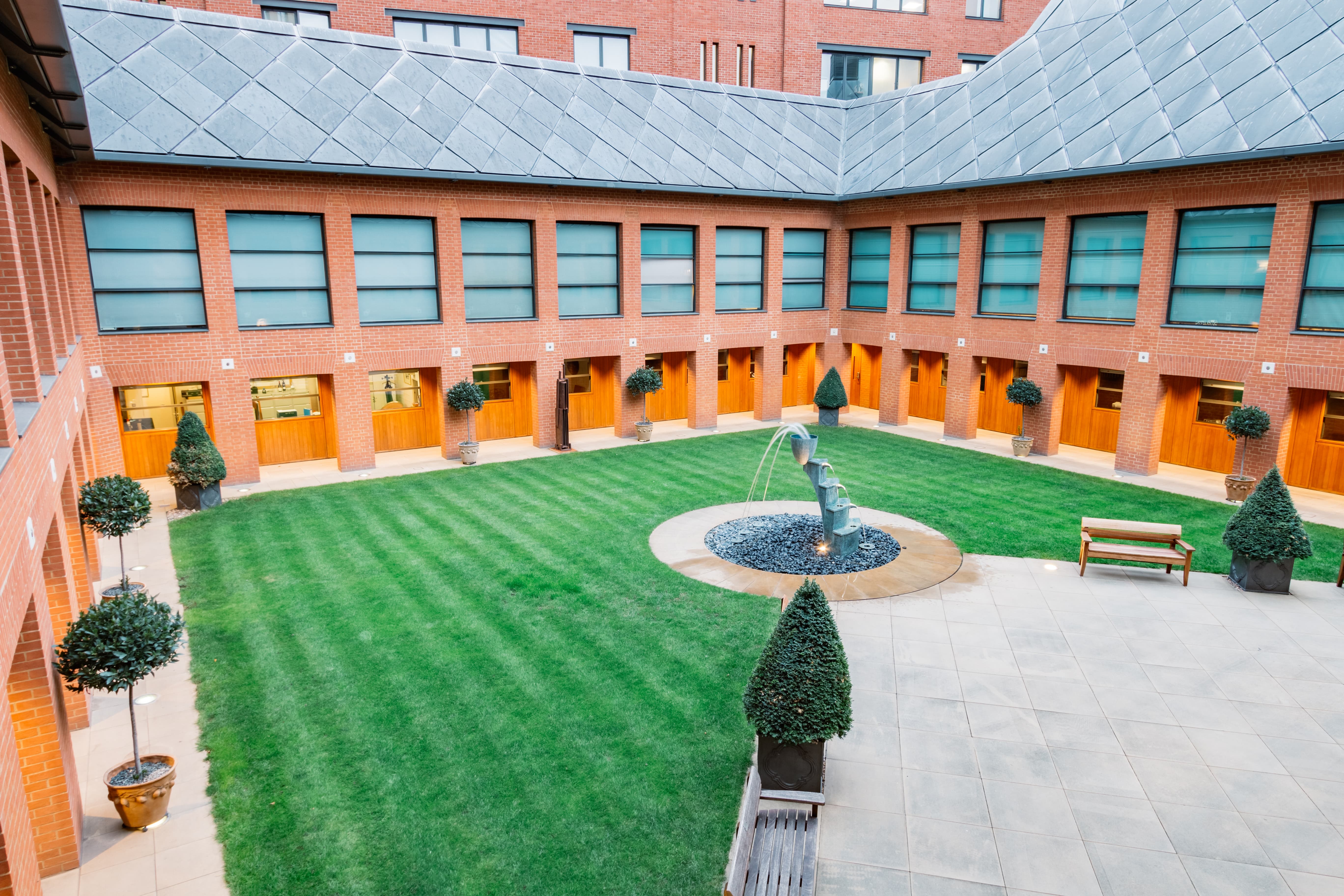 Orangery at Haberdashers' Hall: serene courtyard with fountain for outdoor events.