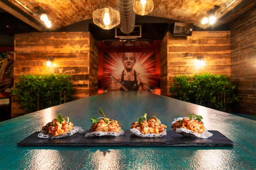 Stylish table with gourmet appetizers at ICE BAR London for cocktail receptions.