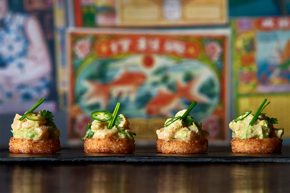 Gourmet hors d'oeuvres on slate at ICE BAR London for corporate gala events.