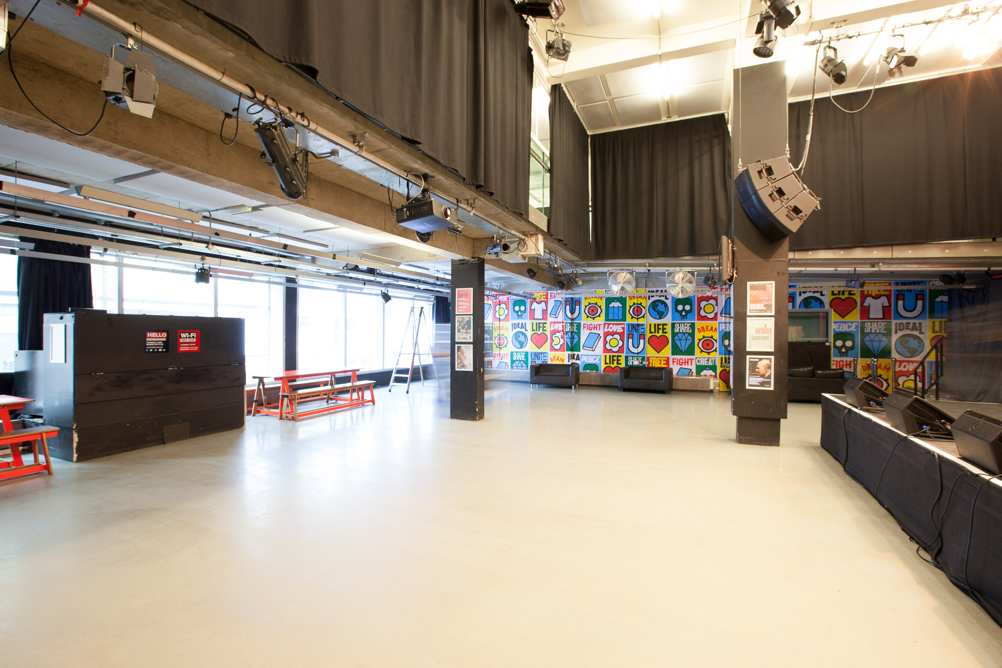 Versatile event space at Rich Mix with vibrant wall art, perfect for corporate and social events.