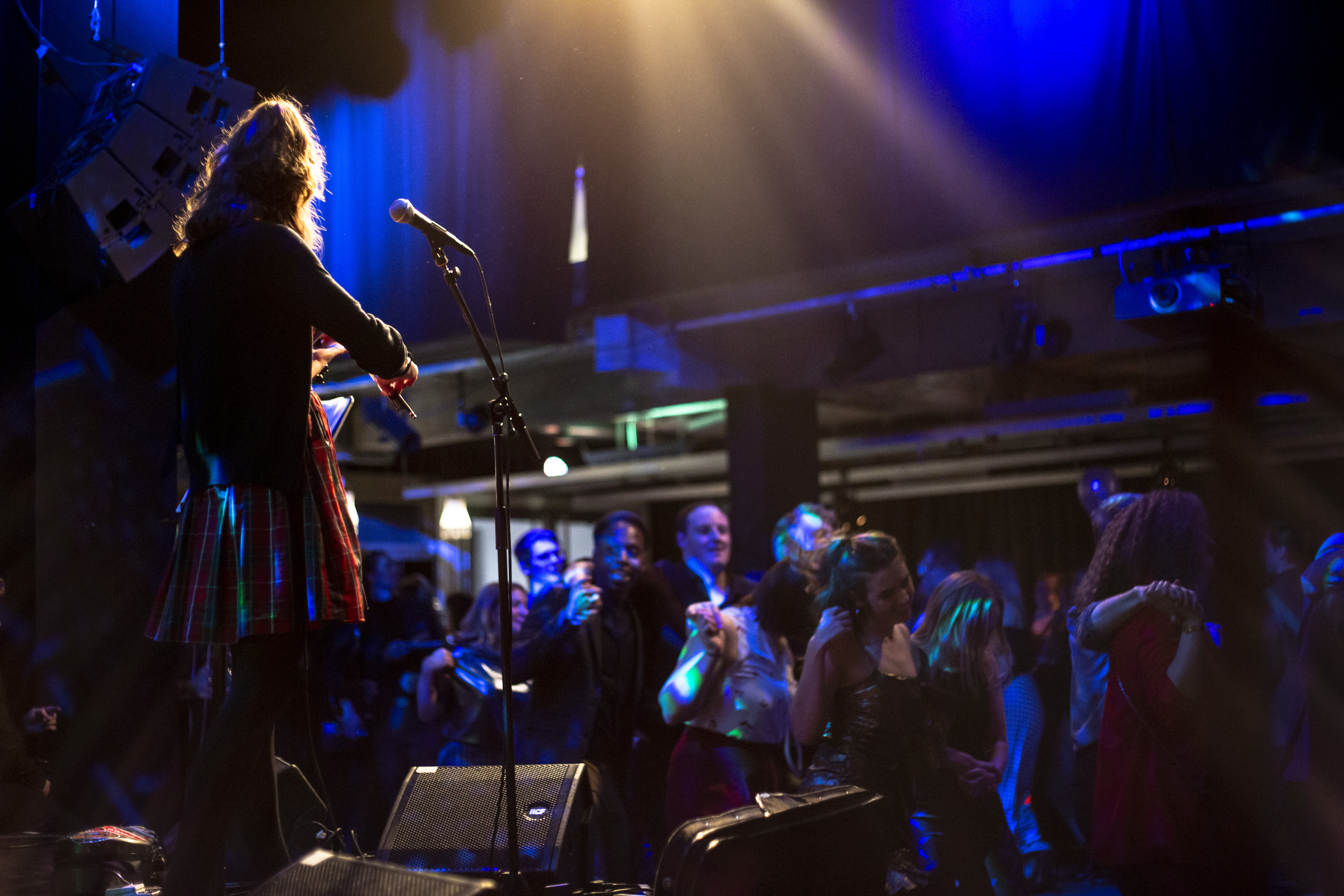 Vibrant live performance at The Stage in Rich Mix with engaging performer and enthusiastic audience.