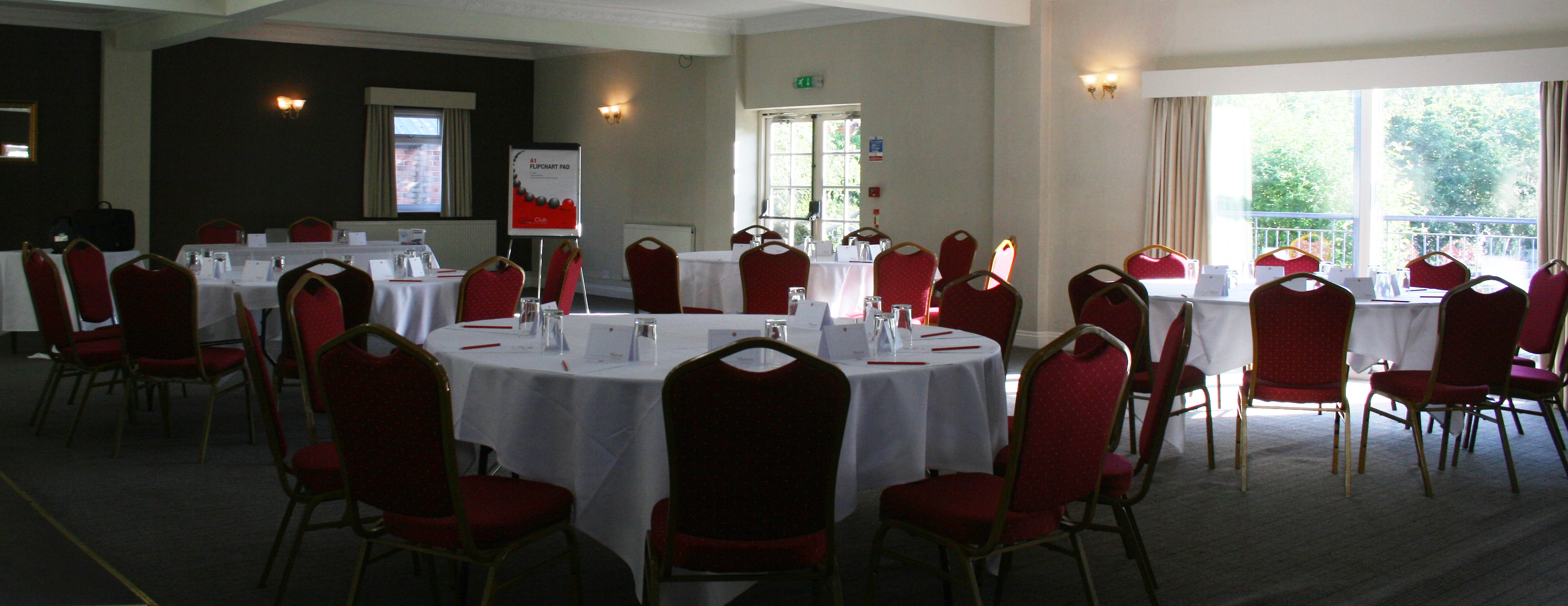 Garden Suite at Best Western Thurrock Hotel, round tables for workshops and conferences.