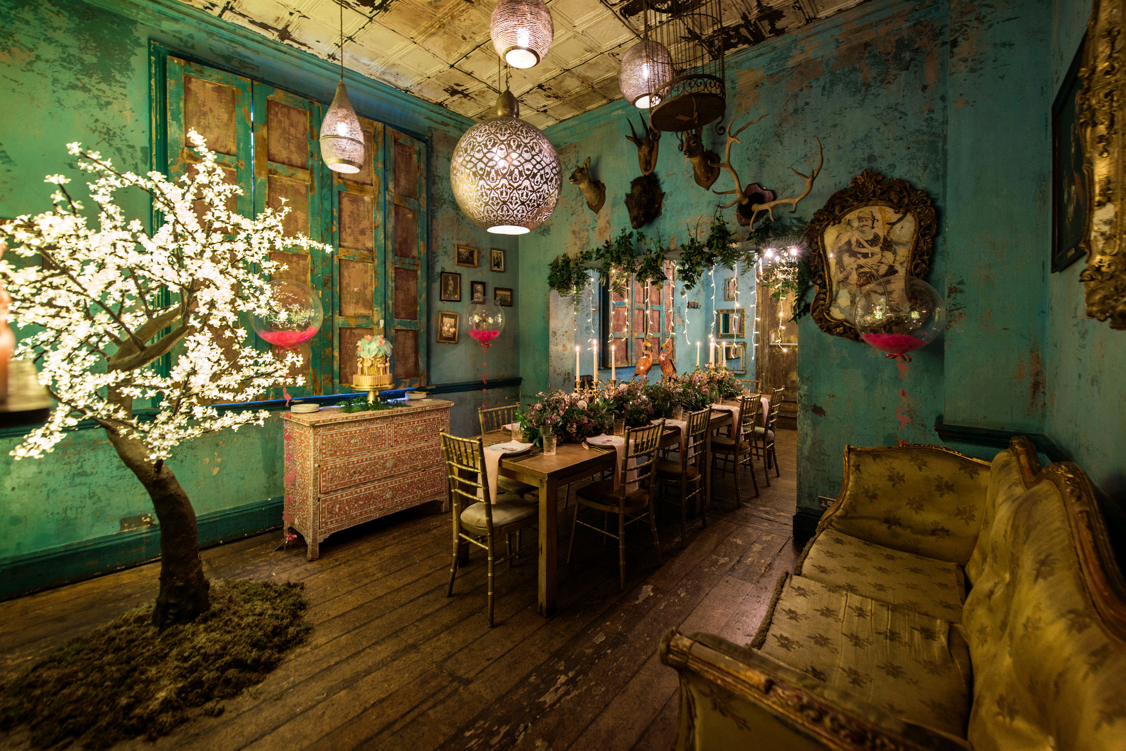 Private dining room with turquoise walls, perfect for intimate events and gatherings.