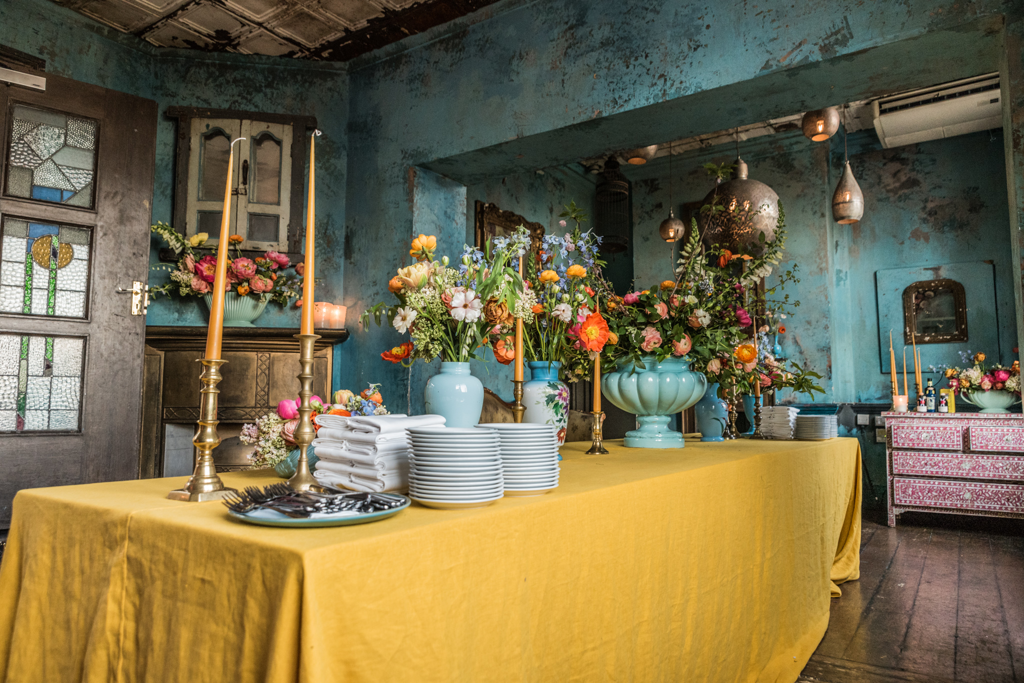 Private dining room with yellow tablecloth, ideal for upscale events and gatherings.