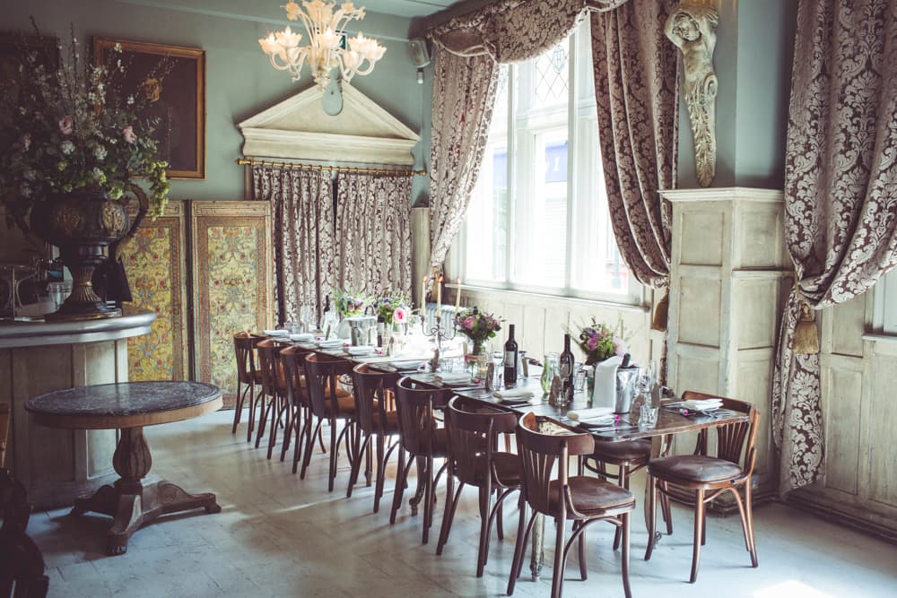 Elegant dining room setup with fine tableware for upscale events and weddings.