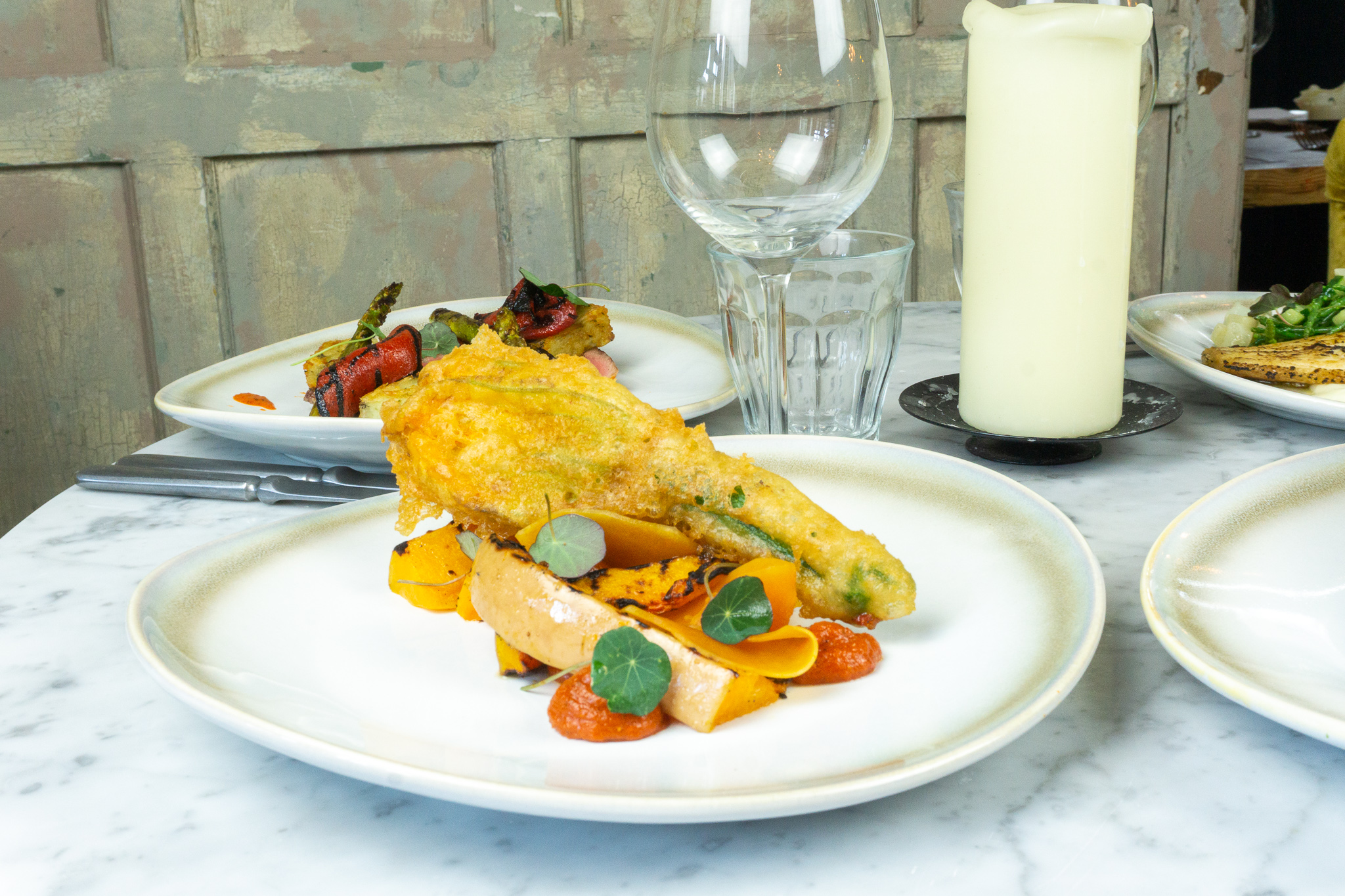 Upscale dining dish with vibrant vegetables for corporate events and gatherings.