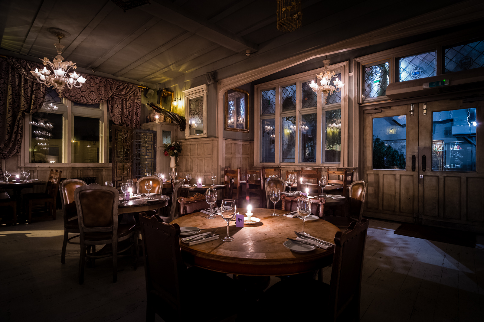 Elegant dining room with warm lighting, perfect for upscale events and intimate gatherings.