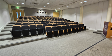 Cotton Theatre auditorium with tiered seating for presentations and lectures in Manchester.