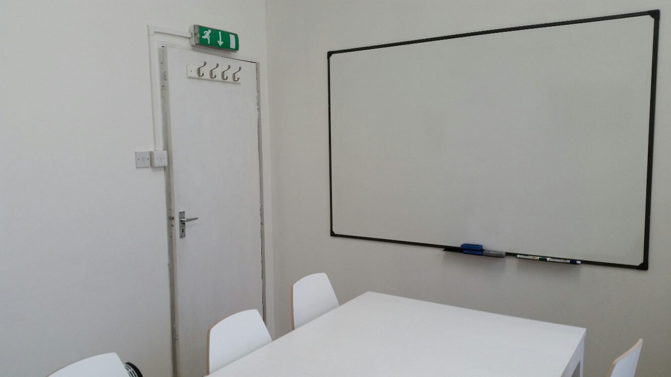 Minimalist meeting room at Clapham North Art Centre, perfect for workshops and brainstorming.