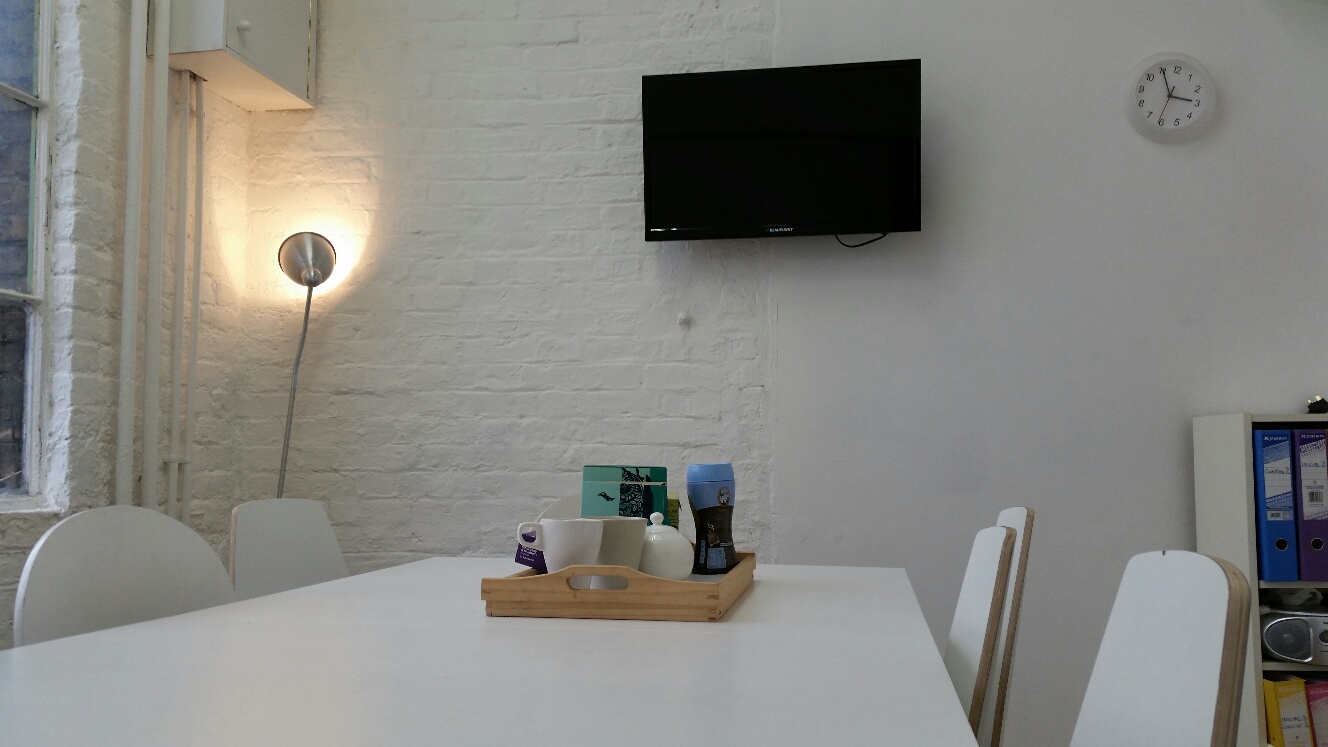 Minimalist meeting space at Clapham North Art Centre, ideal for discussions and presentations.