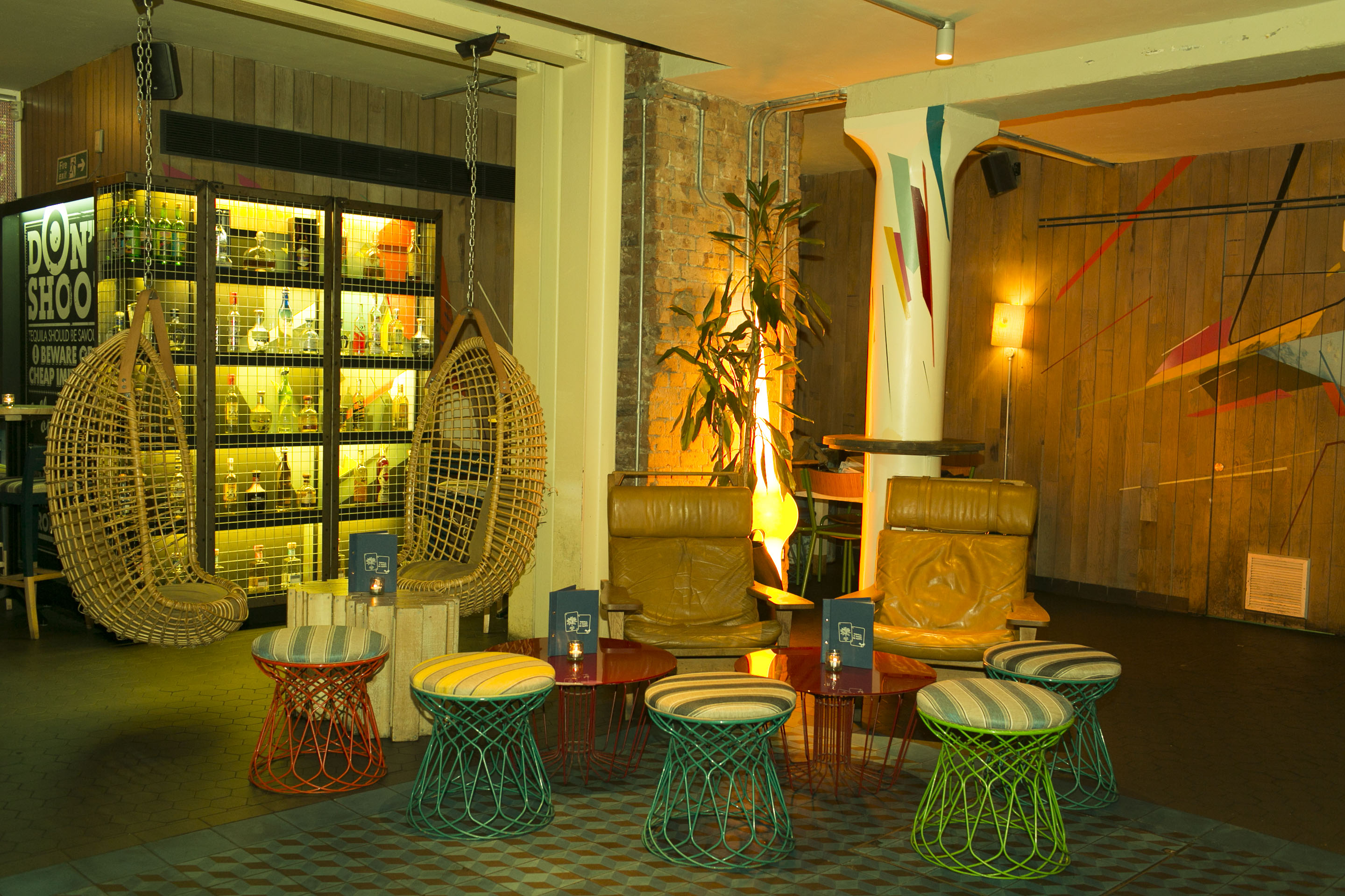 Vibrant lounge area with eclectic seating for networking events at The Azulito Bar.