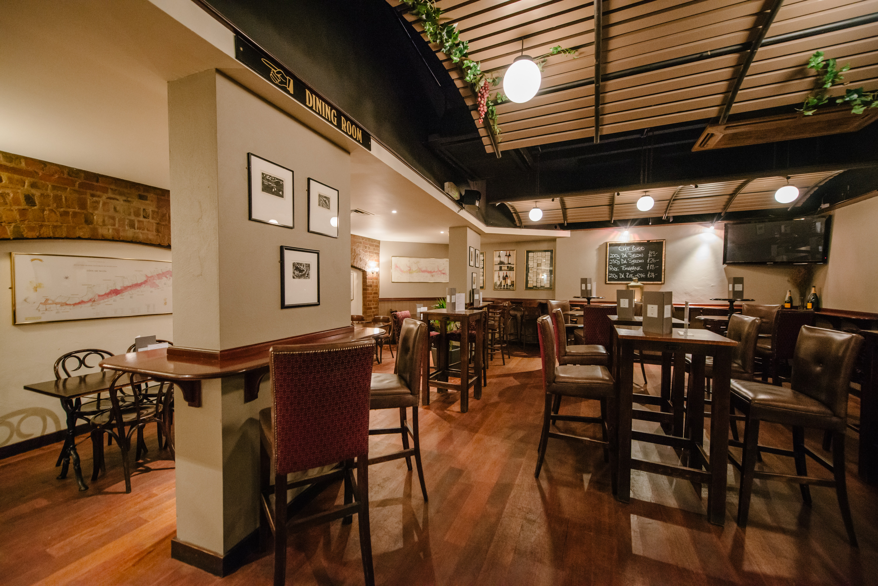 Versatile event space at Willy's Wine Bar with warm ambiance, ideal for networking events.