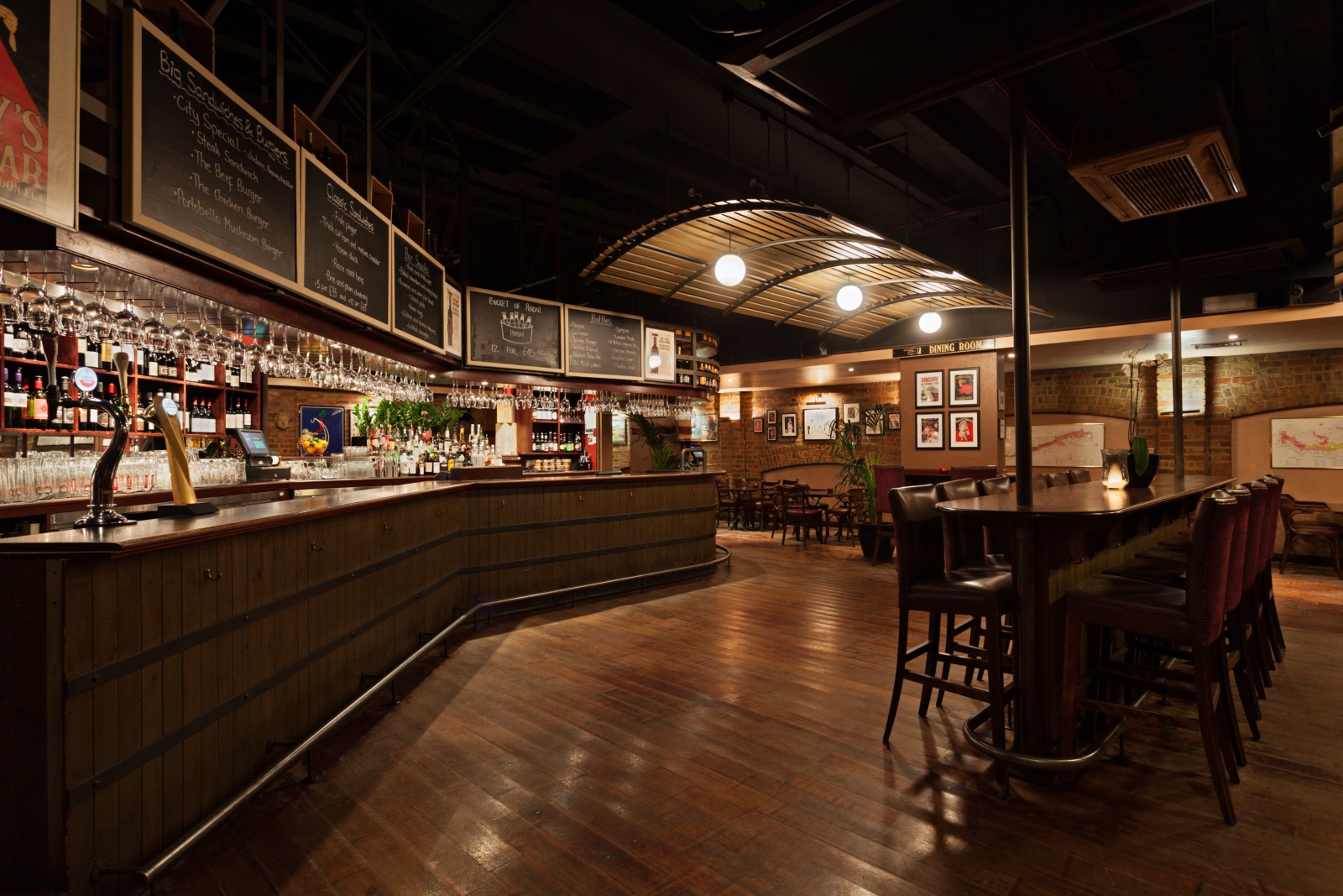 Stylish bar venue with warm lighting, perfect for networking events and meetings.