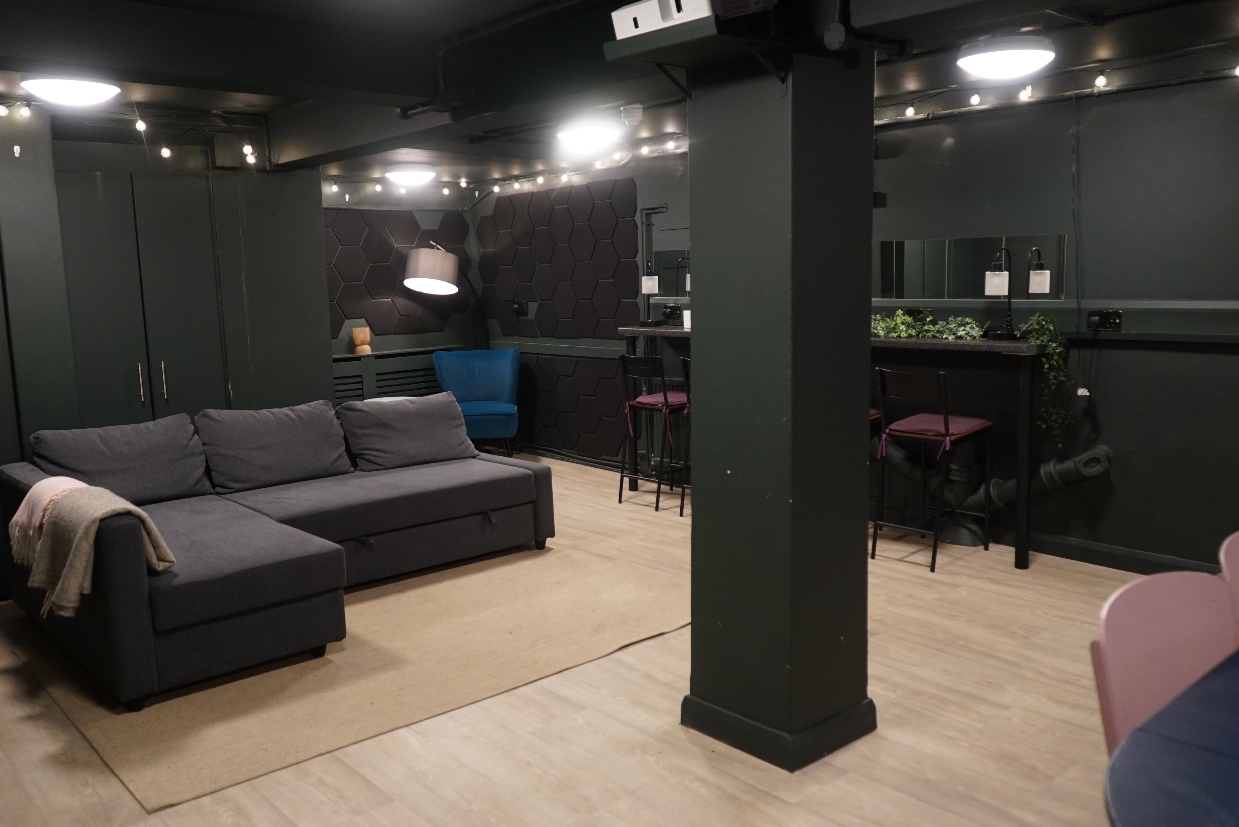 Versatile meeting space with cozy seating at Young Actors Theatre Islington for networking events.