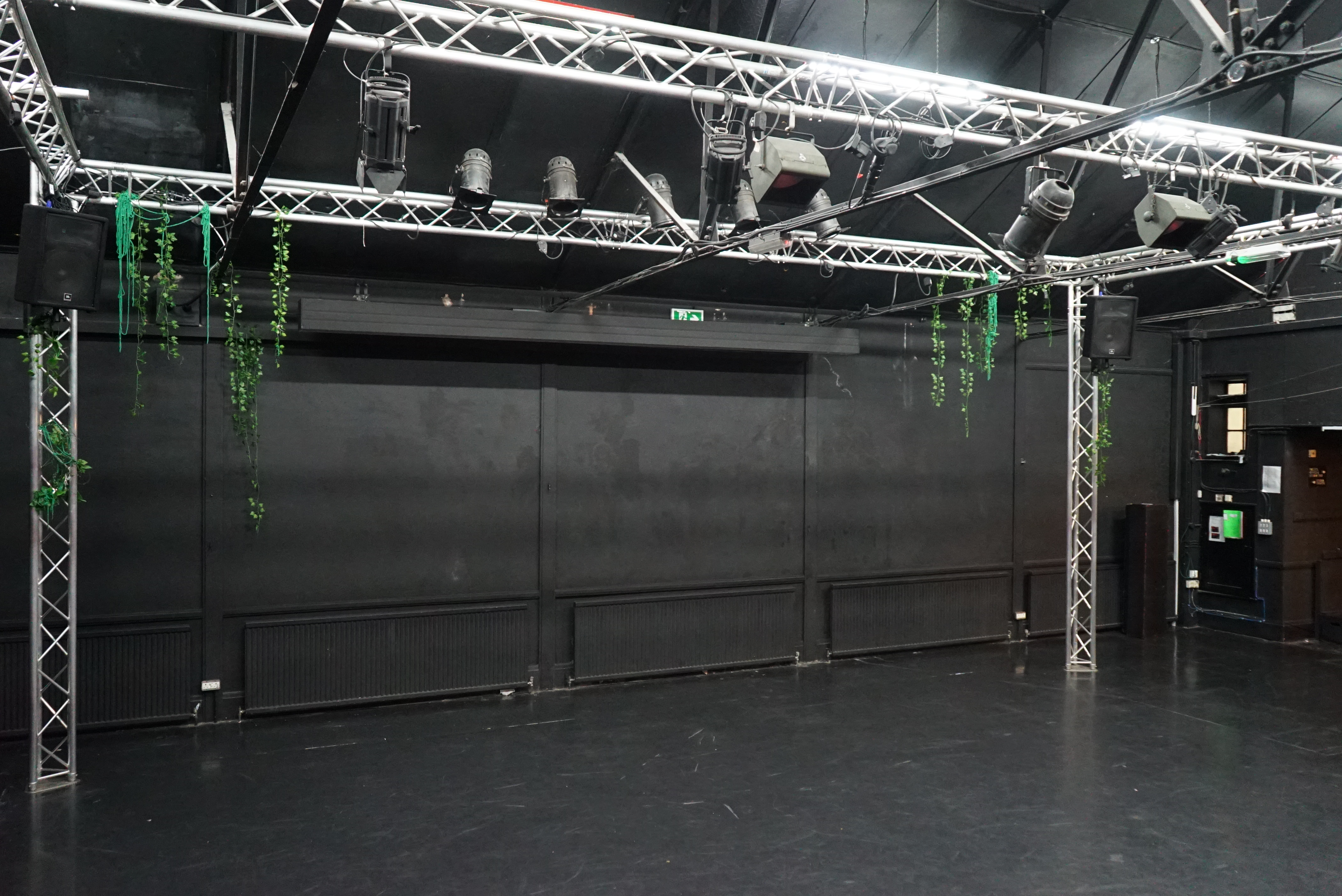 Versatile event space with black backdrop and lighting at Young Actors Theatre Islington.