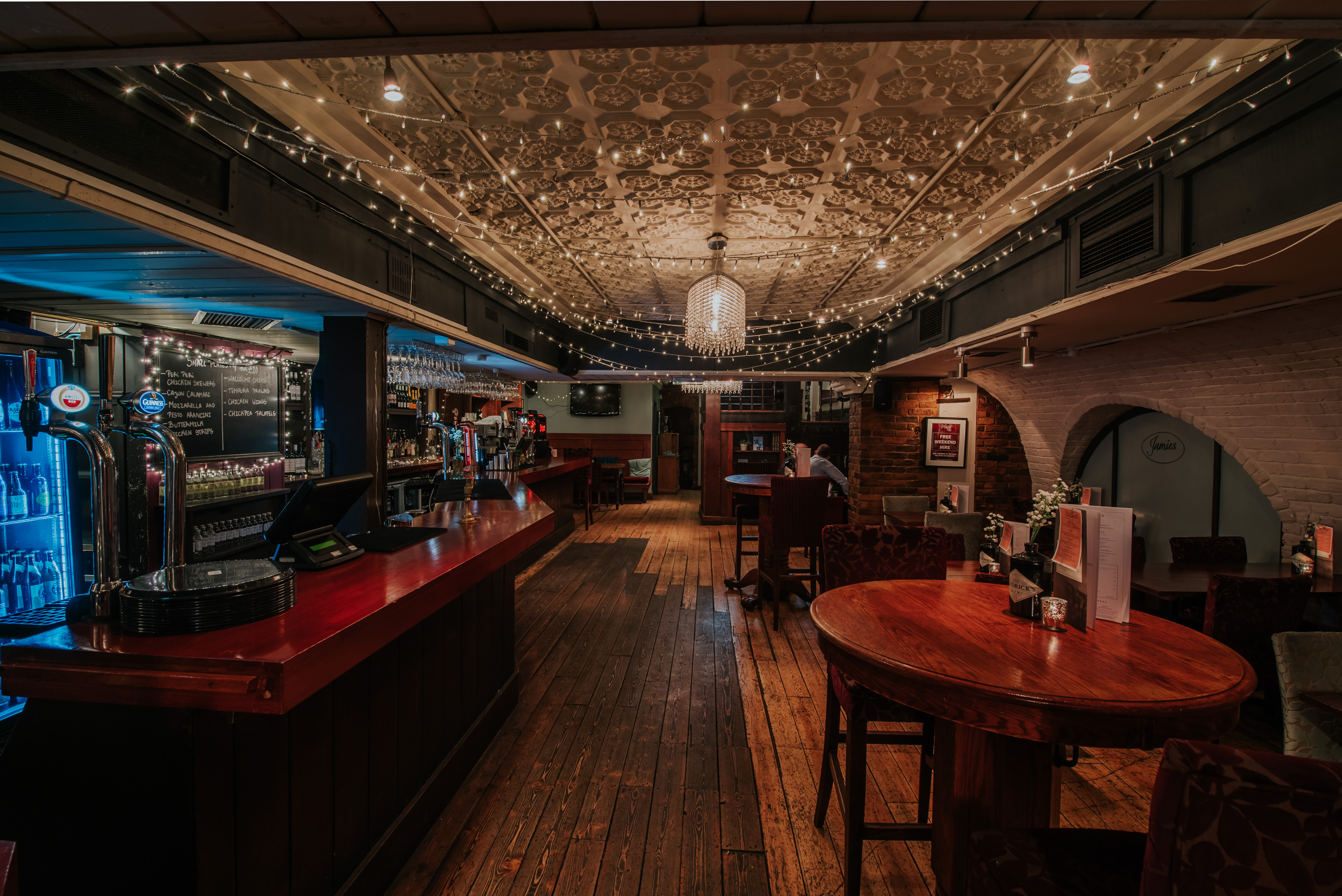 Charming venue with elegant lighting, ideal for intimate gatherings and networking events.