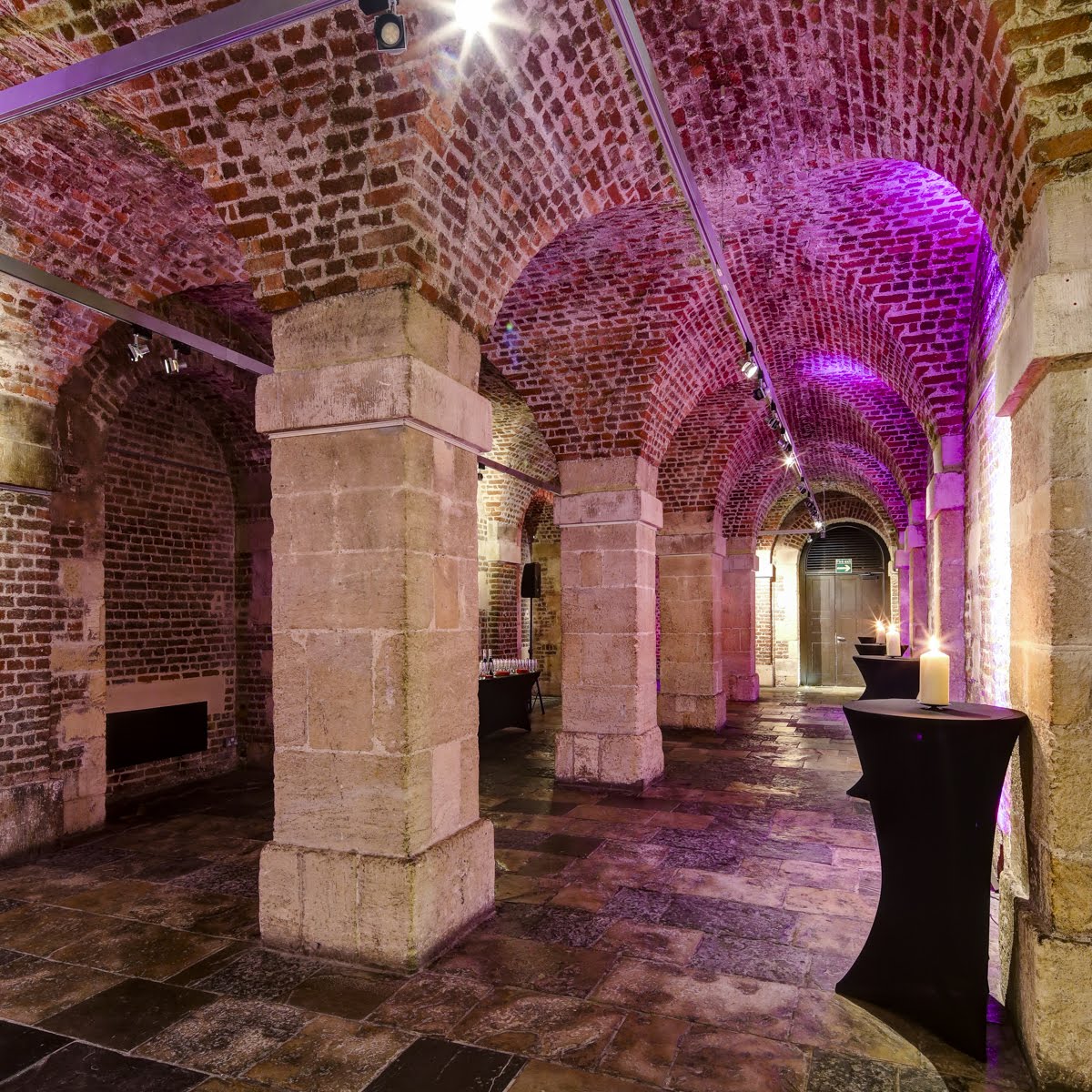 The Gallery in the Crypt: elegant event space with exposed brick, ideal for gatherings.
