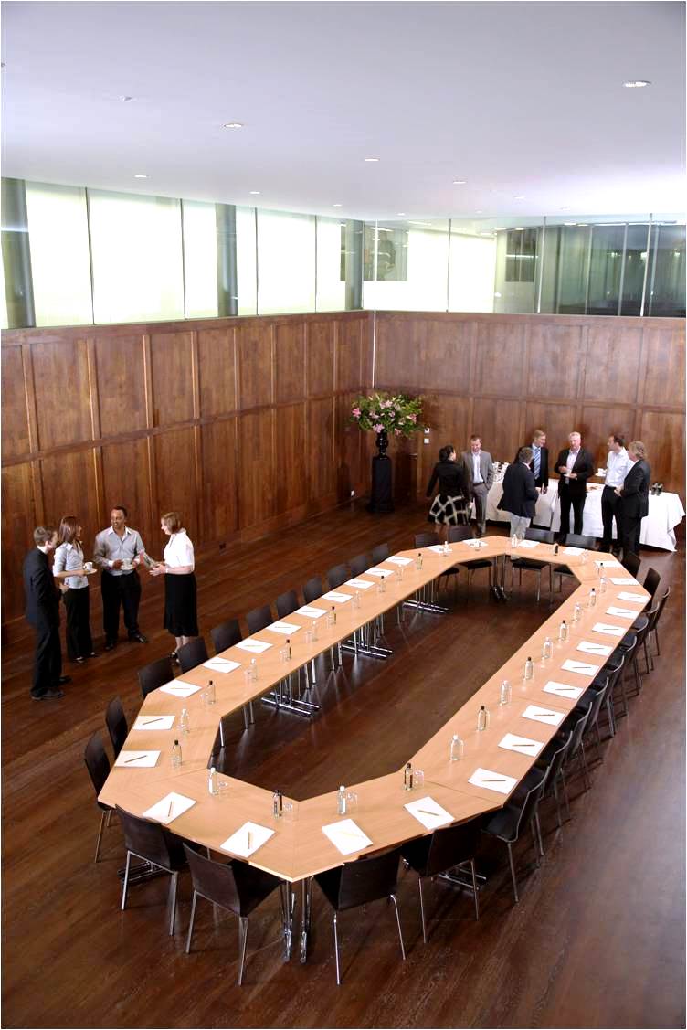St Martins Hall meeting space with wooden walls, ideal for networking events and discussions.