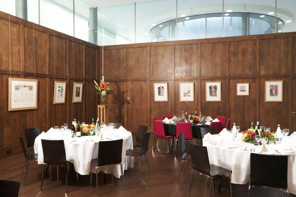 St Martins Hall event space with elegant tables, ideal for upscale meetings and gatherings.