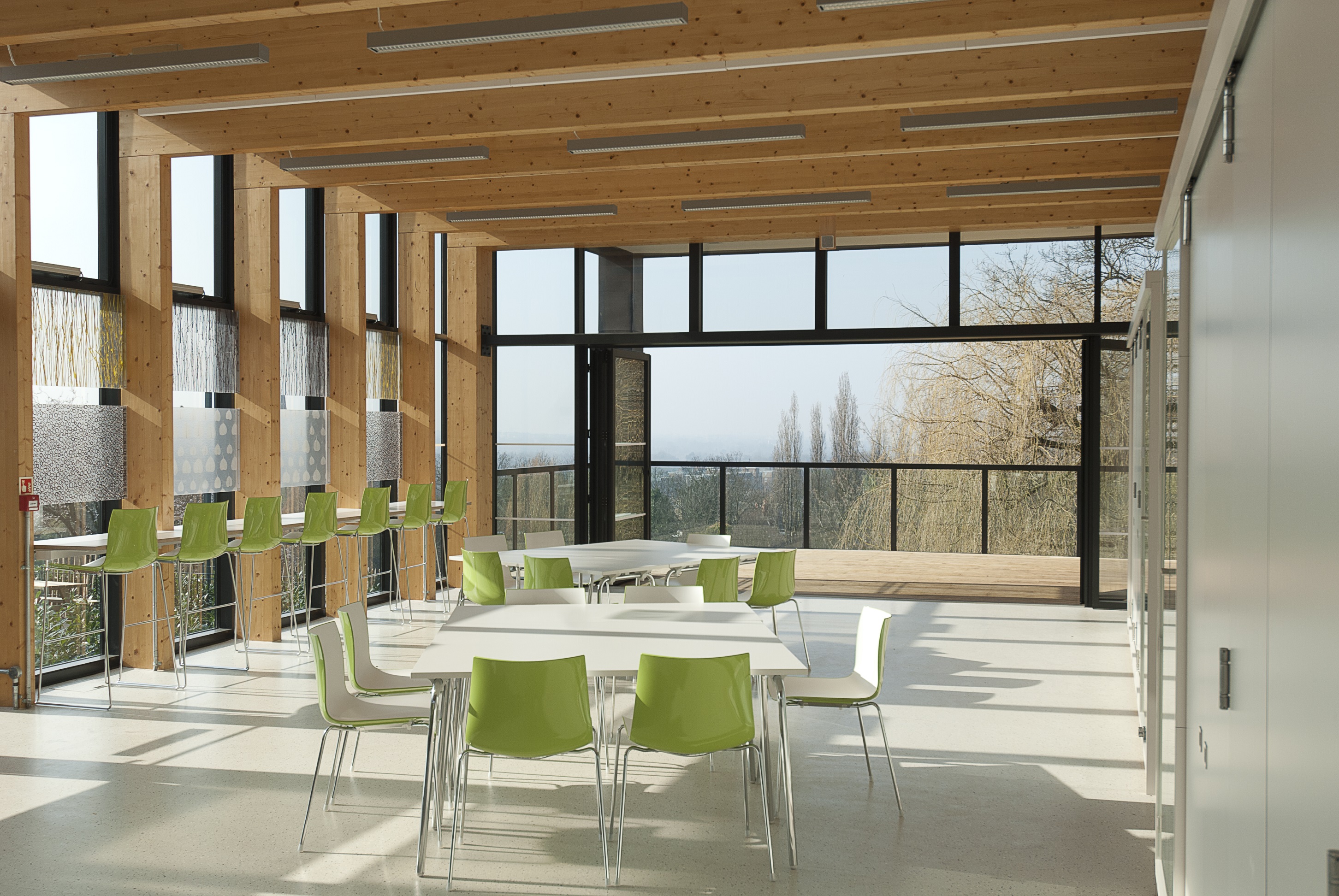 Modern meeting space at Horniman Museum with large windows, ideal for workshops and networking.
