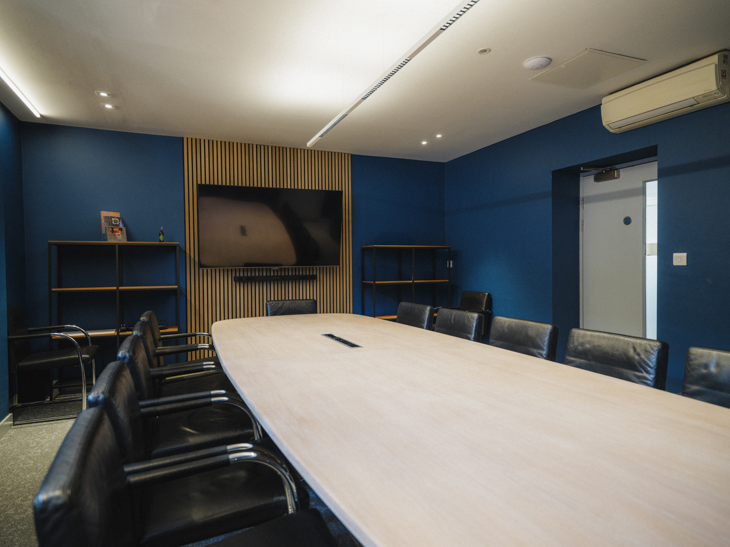Modern conference room at FACT Liverpool with oval table, ideal for meetings and workshops.