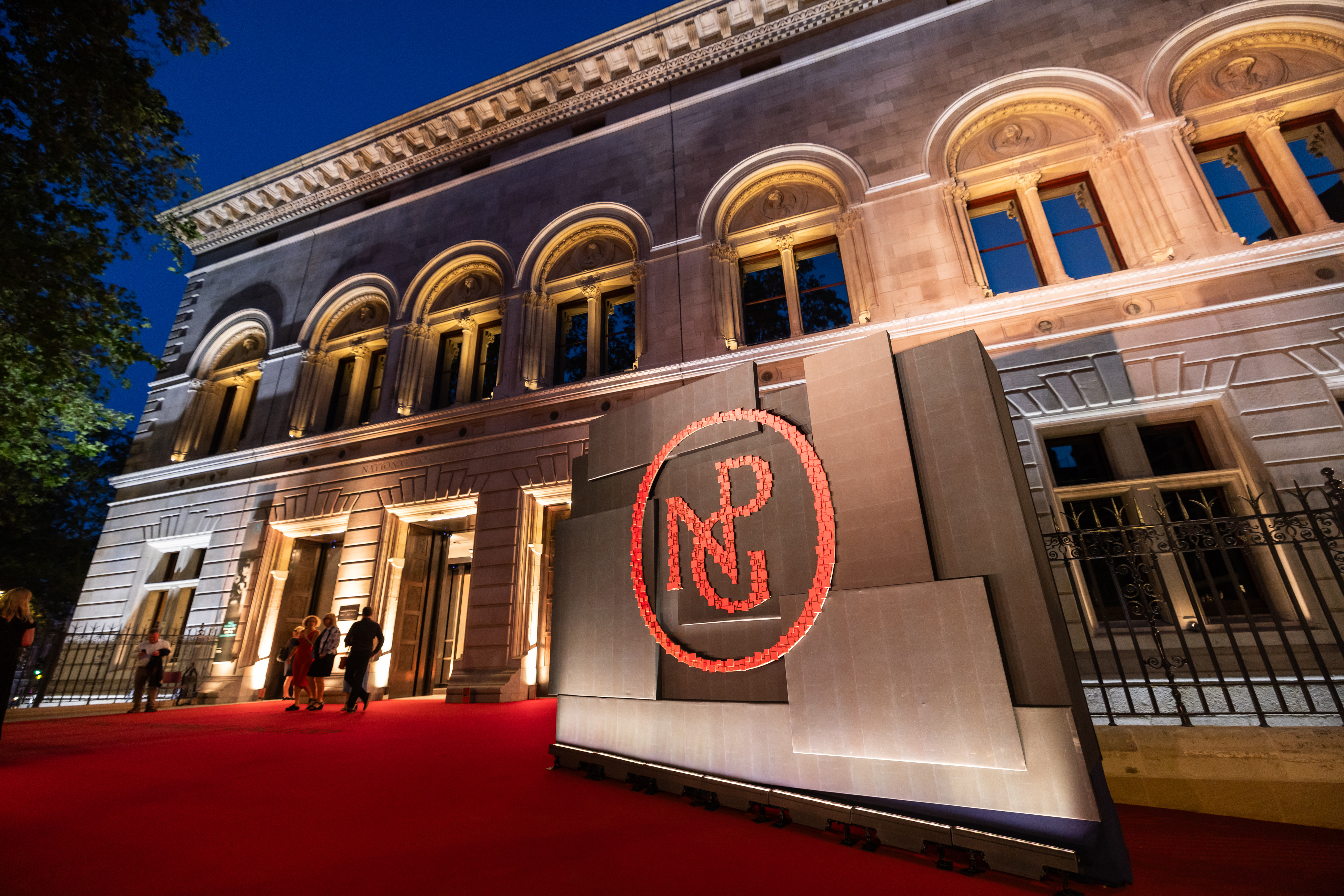 Elegant venue entrance with red carpet at National Portrait Gallery for evening events.