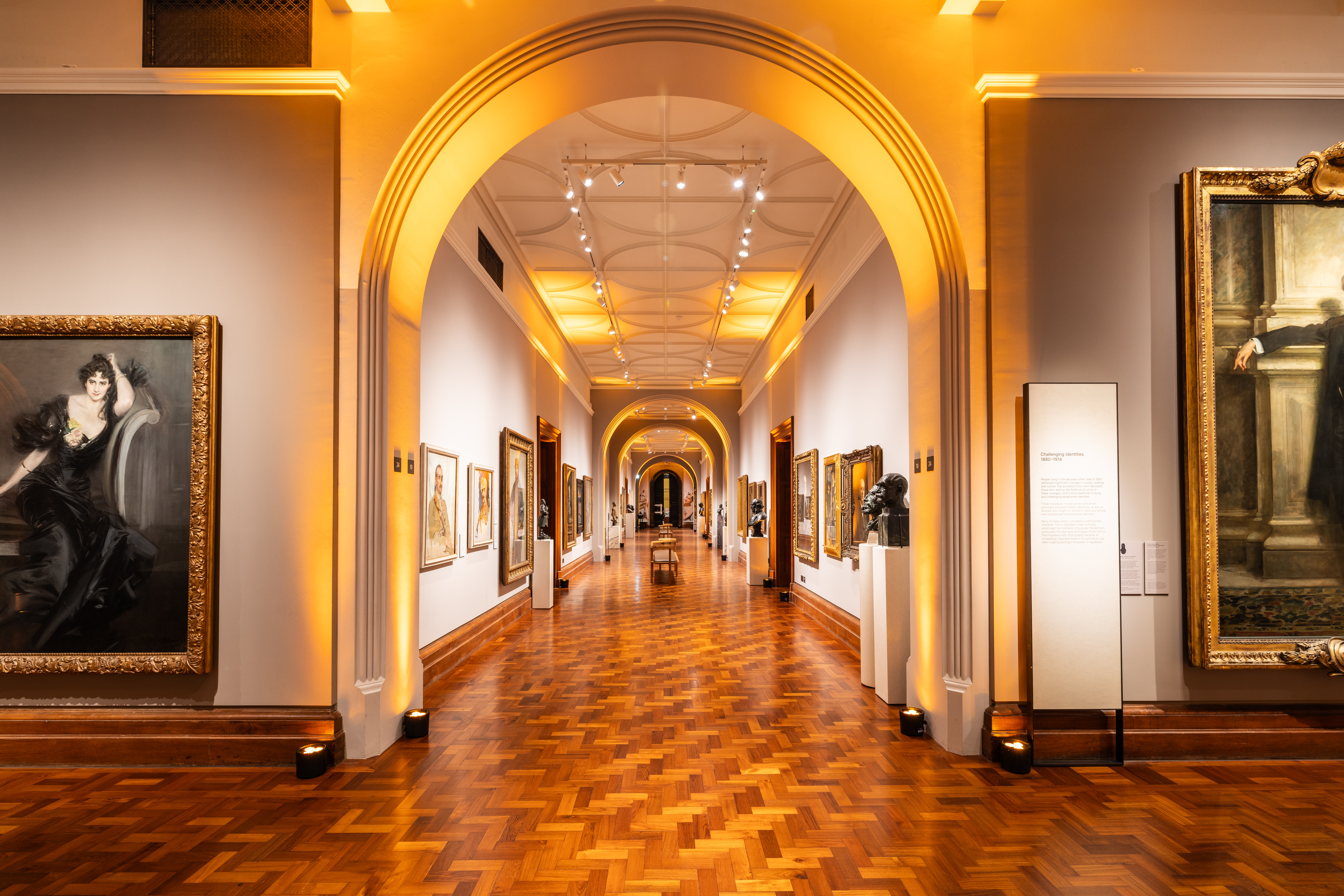 Elegant gallery venue with warm lighting, ideal for art exhibitions and corporate events.