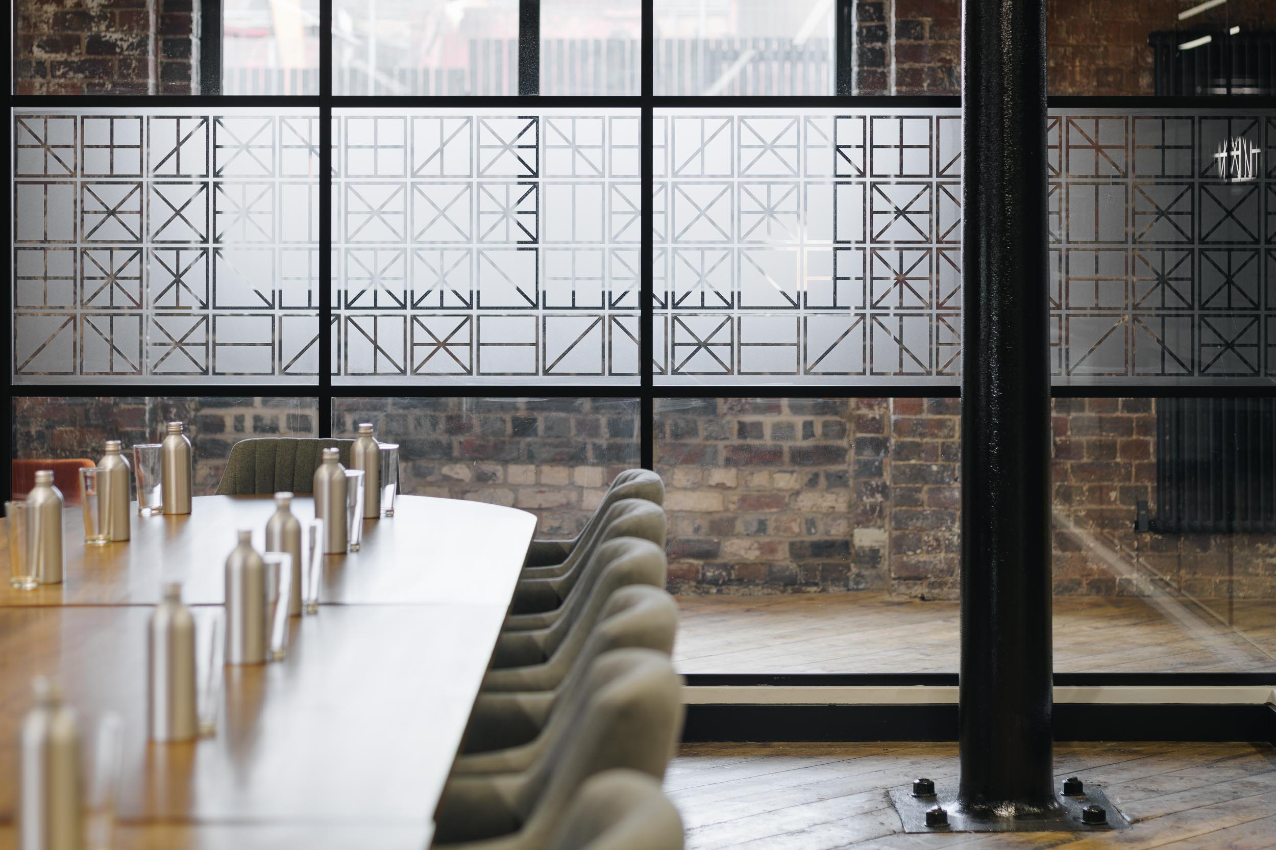 Grand Union Boardroom with long wooden table, ideal for modern meetings and events.