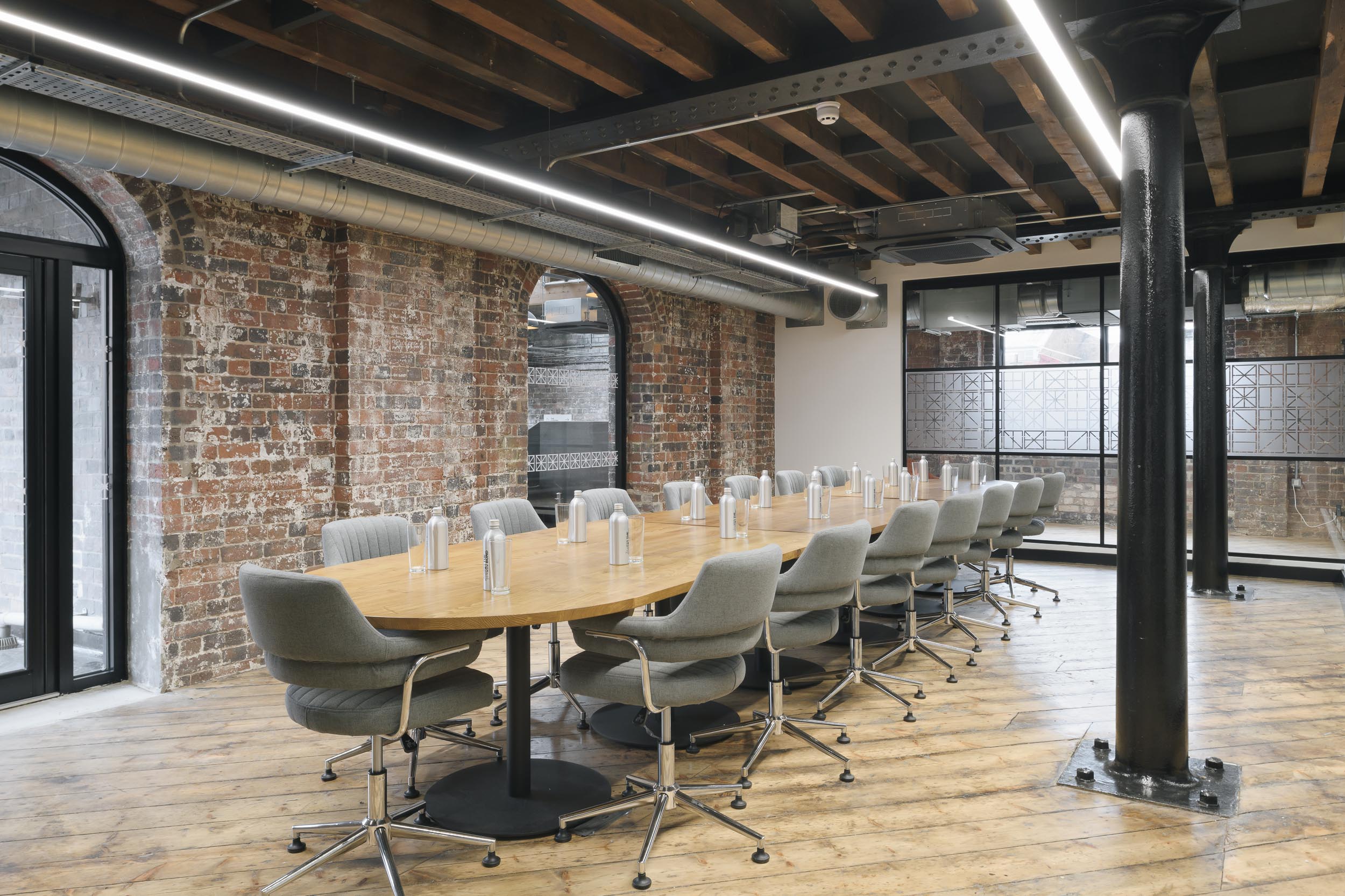 Modern Grand Union Boardroom with oval table, ideal for workshops and meetings.
