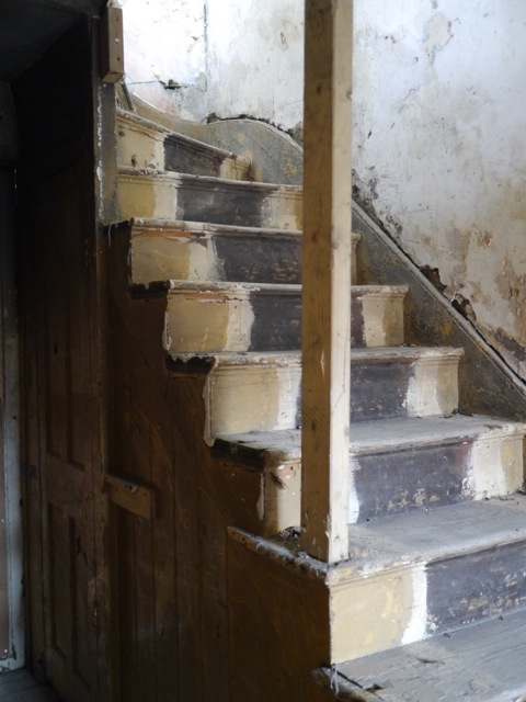 Worn stairs in Safehouse 2 venue, highlighting event safety and aesthetics.